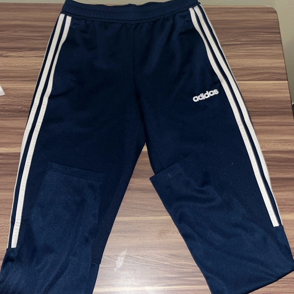 Adidas blue pants with white stripe